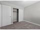 Bedroom featuring carpet flooring, neutral walls, and a closet with bi-fold doors at 9625 Gatesville Ave, Las Vegas, NV 89148