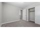 Bedroom featuring carpet flooring, neutral walls, a closet with bi-fold doors and doorway at 9625 Gatesville Ave, Las Vegas, NV 89148