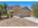 Inviting two story house, with a two car garage, and low maintenance front yard landscaping at 9625 Gatesville Ave, Las Vegas, NV 89148