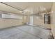 Spacious garage with storage racks, bright lighting, and concrete flooring provides ample space at 9625 Gatesville Ave, Las Vegas, NV 89148