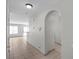 Hallway featuring arched doorways and tile flooring, leading to the living areas and other parts of the home at 9625 Gatesville Ave, Las Vegas, NV 89148