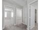 Open hallway featuring carpet flooring, multiple doorways and a bright neutral paint scheme at 9625 Gatesville Ave, Las Vegas, NV 89148