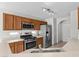 Kitchen featuring stainless steel appliances, wooden cabinets, and ample counter space for meal preparation at 9625 Gatesville Ave, Las Vegas, NV 89148