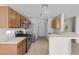 Bright kitchen with stainless steel appliances, ample cabinet space, and a breakfast bar overlooking the living area at 9625 Gatesville Ave, Las Vegas, NV 89148