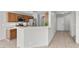Eat-in kitchen featuring wood cabinets, a breakfast bar, tile flooring, and stainless steel appliances at 9625 Gatesville Ave, Las Vegas, NV 89148