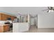 Kitchen area featuring a breakfast bar, stainless steel appliances, wood cabinets and tile flooring at 9625 Gatesville Ave, Las Vegas, NV 89148