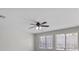 Bright room with a ceiling fan and large windows bringing ample natural light into the living space at 9625 Gatesville Ave, Las Vegas, NV 89148