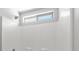 Bright shower with white tiled walls and a window at 9625 Gatesville Ave, Las Vegas, NV 89148