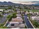 Scenic aerial view showcasing well-maintained landscaping and panoramic mountain views at 9733 Plateau Heights Pl, Las Vegas, NV 89144