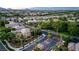 Expansive aerial view of a residential area showcasing lush landscaping and well-maintained streets at 9733 Plateau Heights Pl, Las Vegas, NV 89144