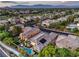 Wide angle neighborhood view highlighting manicured landscaping, mature trees, and surrounding community at 9733 Plateau Heights Pl, Las Vegas, NV 89144