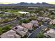Panoramic aerial view showcasing the nearby golf course and lush, landscaped neighborhood at 9733 Plateau Heights Pl, Las Vegas, NV 89144
