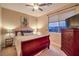 Comfortable bedroom featuring a full-sized bed and a window overlooking the backyard at 9733 Plateau Heights Pl, Las Vegas, NV 89144