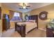 Comfortable bedroom featuring a ceiling fan, and a dark-wood bed frame at 9733 Plateau Heights Pl, Las Vegas, NV 89144