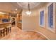 Bright breakfast nook featuring tile floors, wooden cabinets, and windows with shutters at 9733 Plateau Heights Pl, Las Vegas, NV 89144