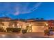 Charming single-story home with a tile roof, an attached two-car garage, and manicured landscaping at 9733 Plateau Heights Pl, Las Vegas, NV 89144