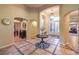 Grand foyer with high ceilings, decorative tile flooring, and an elegant chandelier at 9733 Plateau Heights Pl, Las Vegas, NV 89144