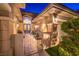 An inviting walkway leads to a secure gated entrance, showcasing a charming home exterior at 9733 Plateau Heights Pl, Las Vegas, NV 89144