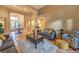 Bright and airy living room with tile floors, comfortable seating, and a welcoming atmosphere at 9733 Plateau Heights Pl, Las Vegas, NV 89144