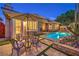 Inviting backyard pool and spa area with elegant patio furniture and verdant landscaping at 9733 Plateau Heights Pl, Las Vegas, NV 89144
