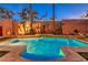 Sparkling pool surrounded by lush landscaping and manicured grass at 9733 Plateau Heights Pl, Las Vegas, NV 89144