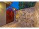 Luxurious outdoor shower with decorative tile and stone wall at 9733 Plateau Heights Pl, Las Vegas, NV 89144