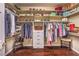 Organized walk-in closet featuring custom shelving, hanging rods, and plenty of storage space at 9733 Plateau Heights Pl, Las Vegas, NV 89144