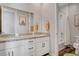 Bright bathroom with dual sinks, granite countertops, and a shower-tub combination at 10161 Bismarck Palms Ave, Las Vegas, NV 89166