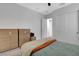 Bedroom with two closets, wood-look floors, and contemporary furniture for a clean and inviting space at 10161 Bismarck Palms Ave, Las Vegas, NV 89166