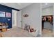 This bedroom offers closet access and a cozy reading nook at 10161 Bismarck Palms Ave, Las Vegas, NV 89166