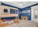 bedroom featuring a bunk bed with a playful design and a blue accent wall at 10161 Bismarck Palms Ave, Las Vegas, NV 89166