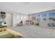 Bright bonus room with windows, open play area, and fun decor, perfect for Gathering activities at 10161 Bismarck Palms Ave, Las Vegas, NV 89166