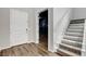 Welcoming foyer featuring hardwood flooring, staircase, and front door at 10161 Bismarck Palms Ave, Las Vegas, NV 89166
