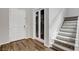 Welcoming foyer featuring hardwood flooring, staircase, and front door at 10161 Bismarck Palms Ave, Las Vegas, NV 89166
