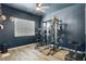 Home gym featuring fitness equipment, and modern flooring at 10161 Bismarck Palms Ave, Las Vegas, NV 89166
