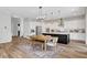 Spacious kitchen with white cabinets, a dark island, and stainless steel appliances at 10161 Bismarck Palms Ave, Las Vegas, NV 89166