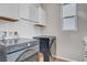 Well-equipped laundry room with modern appliances and ample storage space at 10161 Bismarck Palms Ave, Las Vegas, NV 89166