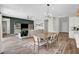 Open-concept living area with a view of the kitchen and comfortable seating at 10161 Bismarck Palms Ave, Las Vegas, NV 89166