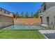Fenced-in pool with artificial grass and patio offers a safe and enjoyable backyard retreat at 10161 Bismarck Palms Ave, Las Vegas, NV 89166