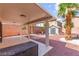 Backyard view with covered patio, shed, and desert landscaping at 11755 Garland Grove Ln, Las Vegas, NV 89183