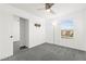 Bedroom boasts gray carpet, ceiling fan, and a closet with sliding doors at 11755 Garland Grove Ln, Las Vegas, NV 89183