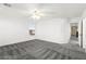 Bright bedroom with neutral walls, a ceiling fan, and plush carpet at 11755 Garland Grove Ln, Las Vegas, NV 89183