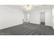 Spacious carpeted bedroom with a ceiling fan and multiple interior doors at 11755 Garland Grove Ln, Las Vegas, NV 89183