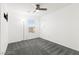 Clean, carpeted bedroom features a ceiling fan and window at 11755 Garland Grove Ln, Las Vegas, NV 89183