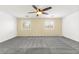 Large bedroom with neutral walls, carpet, and a ceiling fan providing ample light at 11755 Garland Grove Ln, Las Vegas, NV 89183