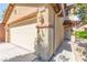 Beautiful home featuring a two-car attached garage and a welcoming front entrance at 11755 Garland Grove Ln, Las Vegas, NV 89183