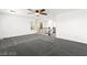 Open loft with decorative railing, fan and plush carpet, perfect for entertaining or relaxing at 11755 Garland Grove Ln, Las Vegas, NV 89183