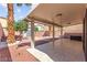 Beautiful covered patio with tile floor, backyard access and views at 11755 Garland Grove Ln, Las Vegas, NV 89183