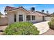 This backyard has an outdoor patio, beige stucco, and desert landscaping at 118 Westin Ln, Henderson, NV 89002