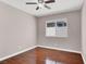 Bedroom featuring a ceiling fan, hardwood floors, and natural light at 118 Westin Ln, Henderson, NV 89002